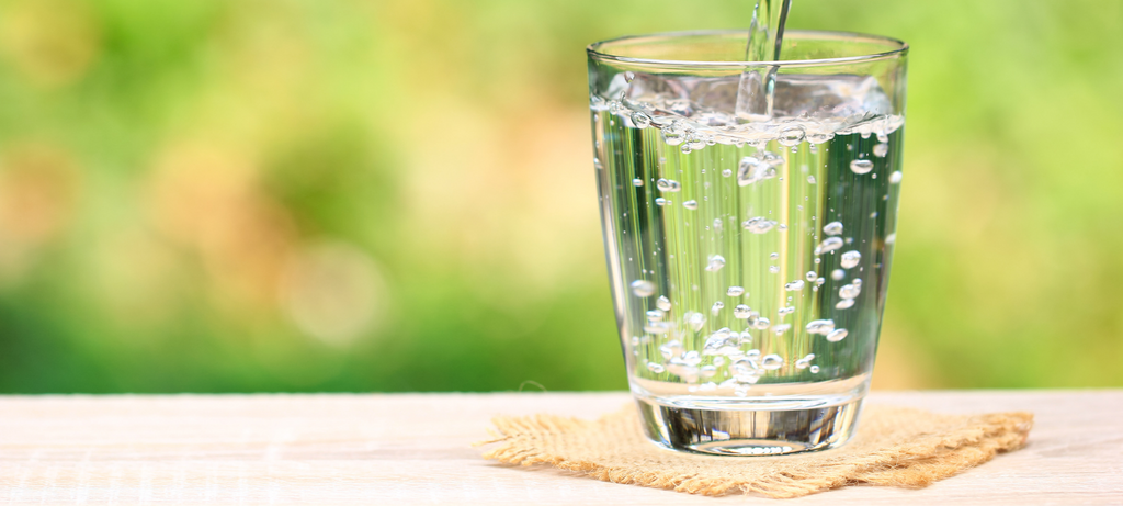 Mohammadreza drinks water from a glass 