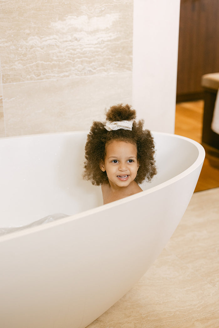 Filter the water your family bathe in - from a baby's first bath to the end of a long day