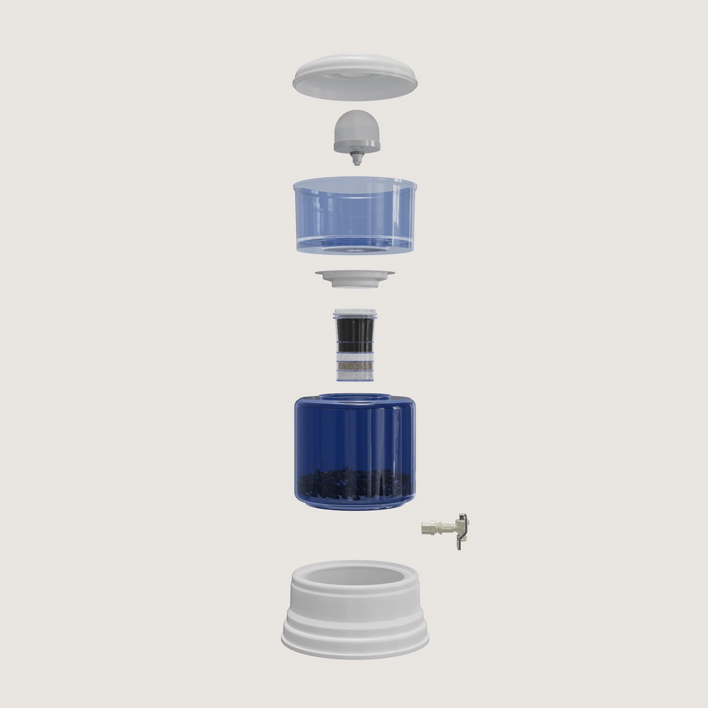 Exploded view of the zazen Alkaline Water System showing each component from top to bottom: lid, ceramic pre-filter, top tank, tank connector, multi-stage filter cartridge, bottom tank with mineral stones, tap and base.